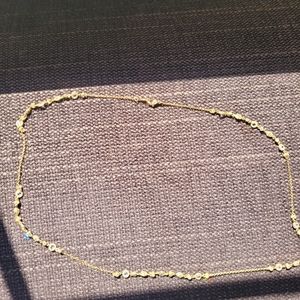 Gold toned and Crystal Necklace with "N" on Clasp